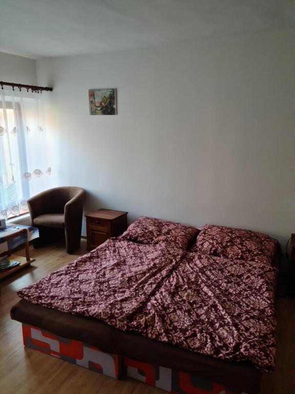 Posteľ alebo postele v izbe v ubytovaní Penzión Larix Blatnica