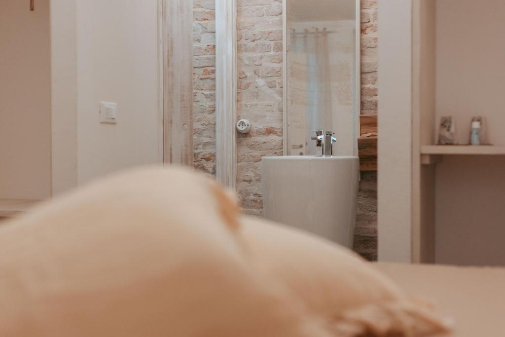 a bathroom with a shower and a sink in a room at Laguna Suite B&B in Chioggia