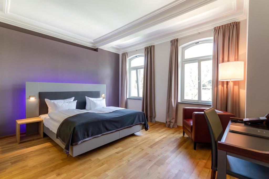Postel nebo postele na pokoji v ubytování Qube Hotel Bergheim