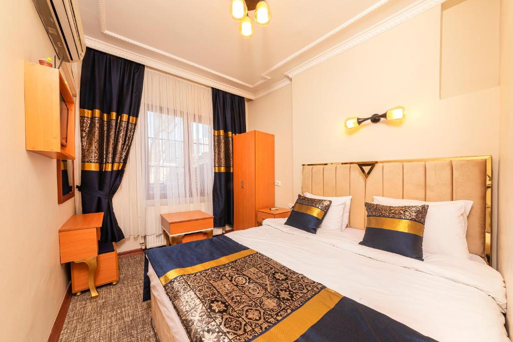 Un pat sau paturi într-o cameră la Vefa Hotel&Suites