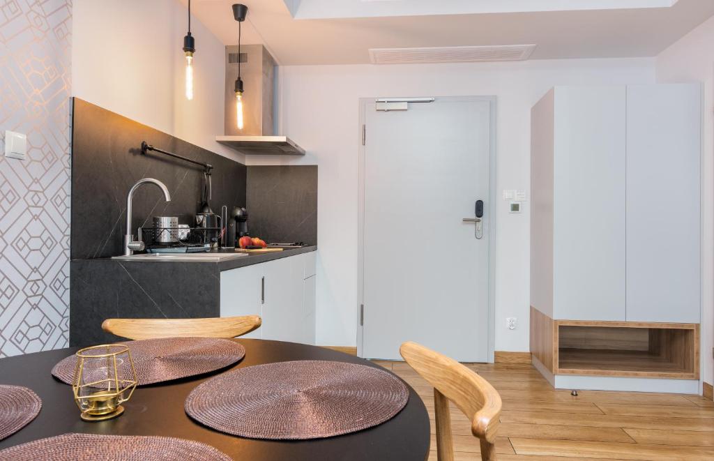 Kuchyň nebo kuchyňský kout v ubytování Apartament Mechelinki