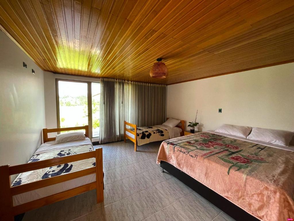 Postel nebo postele na pokoji v ubytování Lujosa Casa Quinta en Naturaleza Andina
