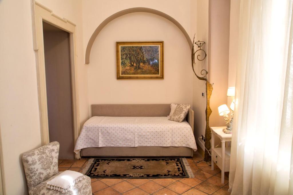 Postel nebo postele na pokoji v ubytování Casa Raiola Ercolano Luxury Rooms & Spa