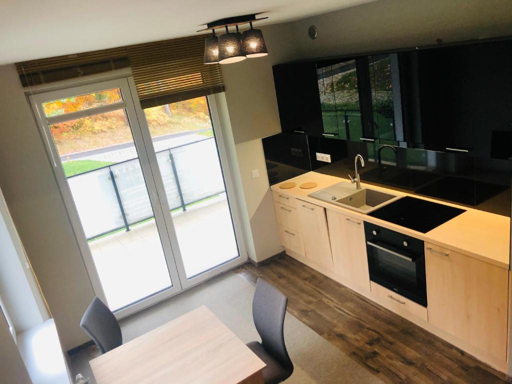 Kuchyňa alebo kuchynka v ubytovaní Apartament Piano