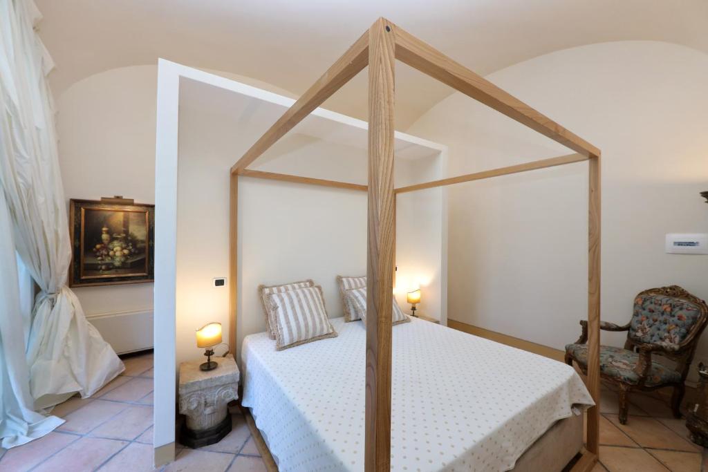 Postel nebo postele na pokoji v ubytování Casa Raiola Ercolano Luxury Rooms & Spa