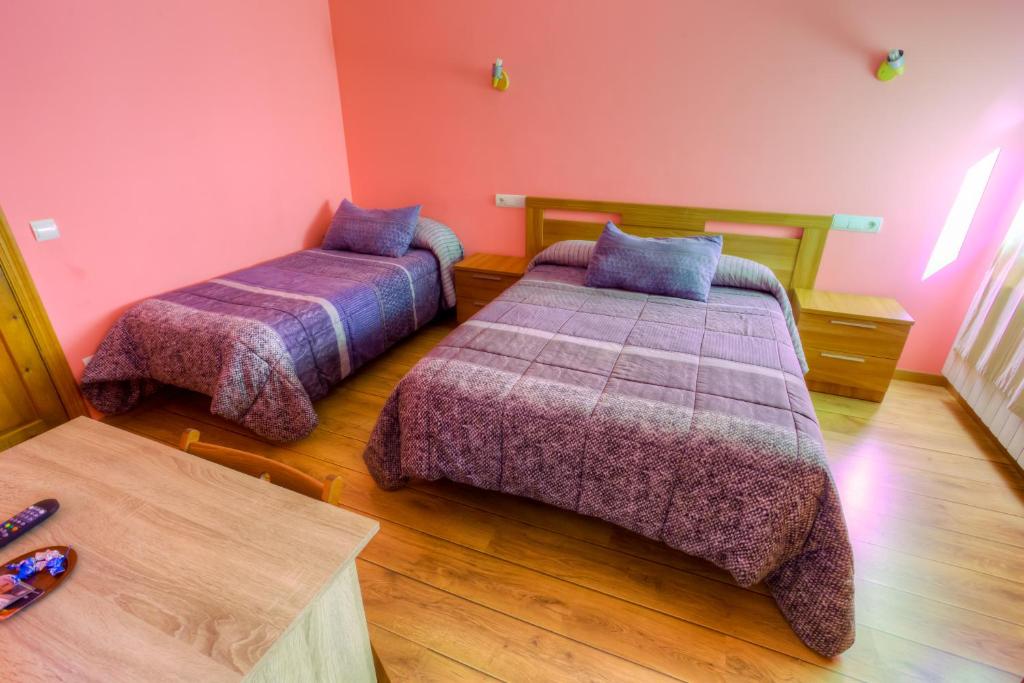 Postel nebo postele na pokoji v ubytování Hostal Rural La Tintoreria