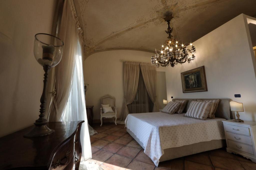 Postel nebo postele na pokoji v ubytování Casa Raiola Ercolano Luxury Rooms & Spa