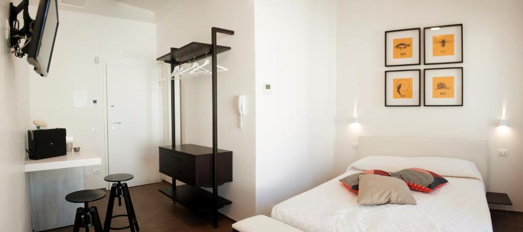 Posteľ alebo postele v izbe v ubytovaní Via Del Faro Apartments
