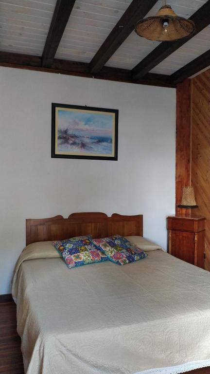 a bedroom with a bed and a ceiling at Room in Casa Castiglia a Woodhouse with Beautiful View close Madonie Park in Castelbuono