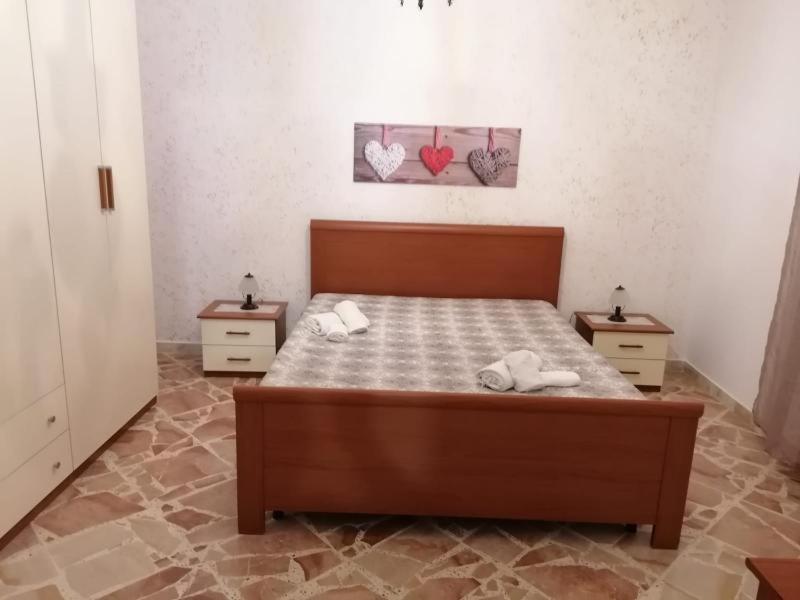A bed or beds in a room at La Dolce Oasi