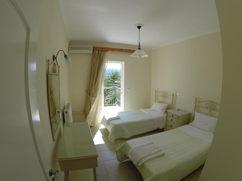 A bed or beds in a room at Irini's Villa