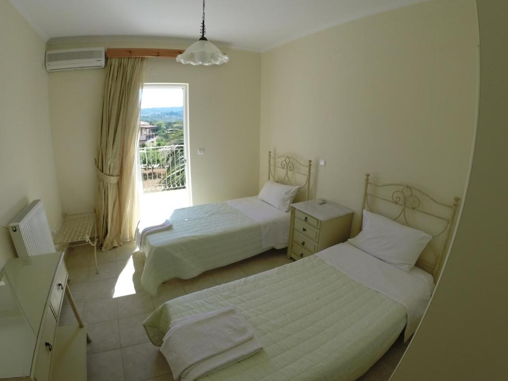 A bed or beds in a room at Irini's Villa