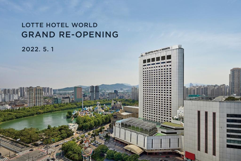 
a large building with a clock on top of it at Lotte Hotel World in Seoul

