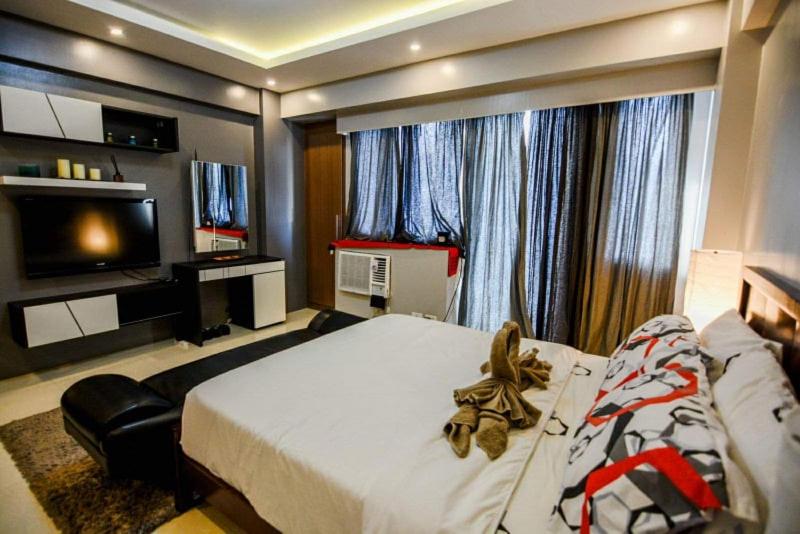 Postel nebo postele na pokoji v ubytování palm tree villas