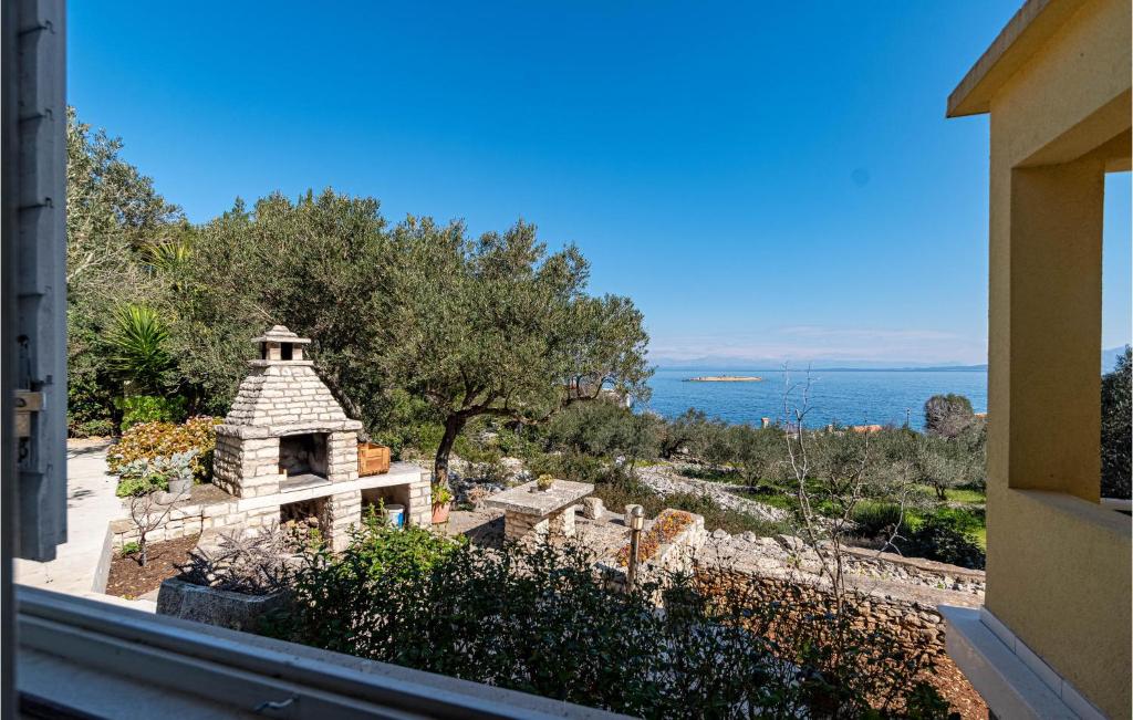 a view of the ocean from a house at Lovely Home In Blato With House Sea View in Blato