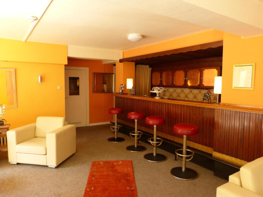 Ein Sitzbereich in der Unterkunft Hotel Imperial