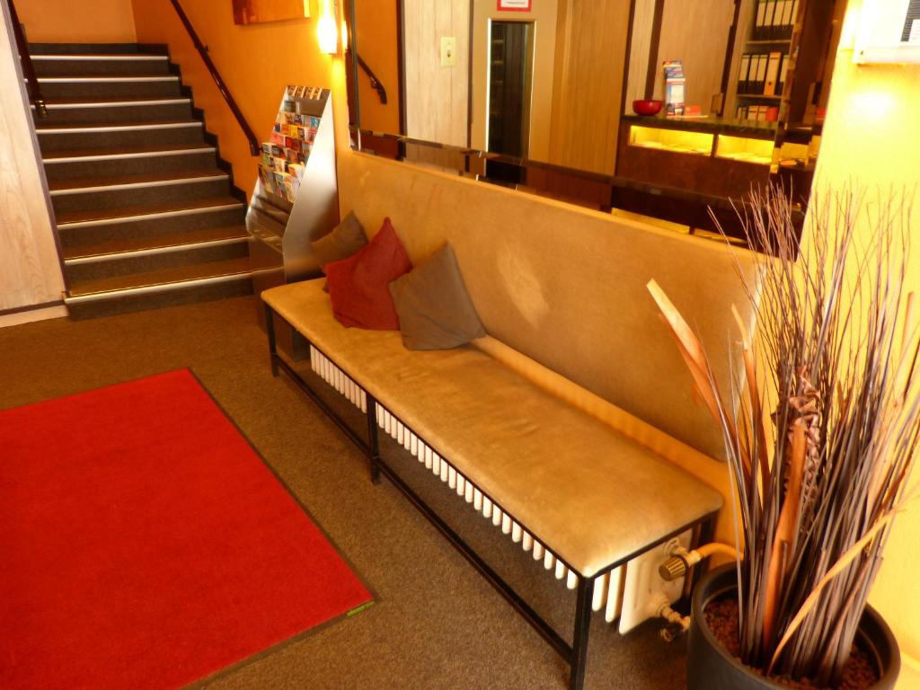Ein Sitzbereich in der Unterkunft Hotel Imperial