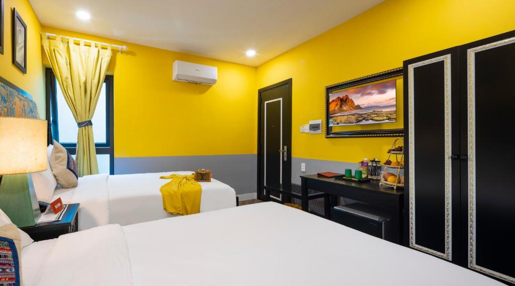 Giường trong phòng chung tại Heritage Boutique Sierra Legend
