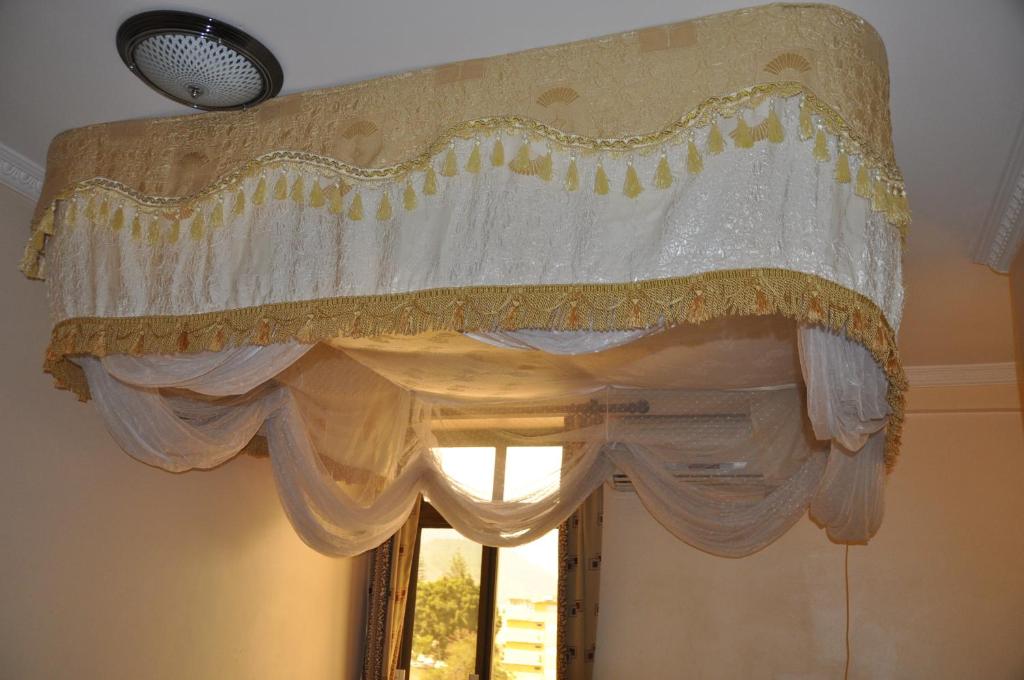 Postel nebo postele na pokoji v ubytování Rich Hotel