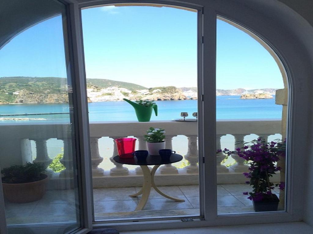 a window view of the ocean from a balcony at Casa Tatillo - Immobilevante in Ponza