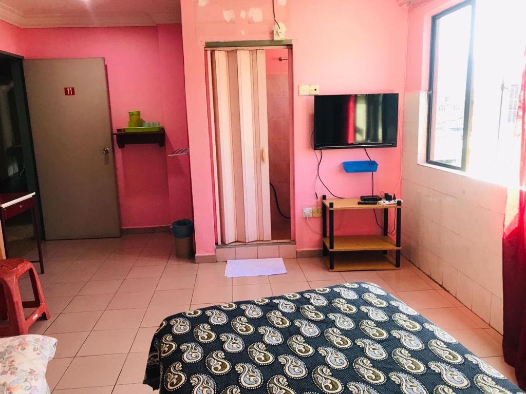 TV a/nebo společenská místnost v ubytování Hotel Cahaya