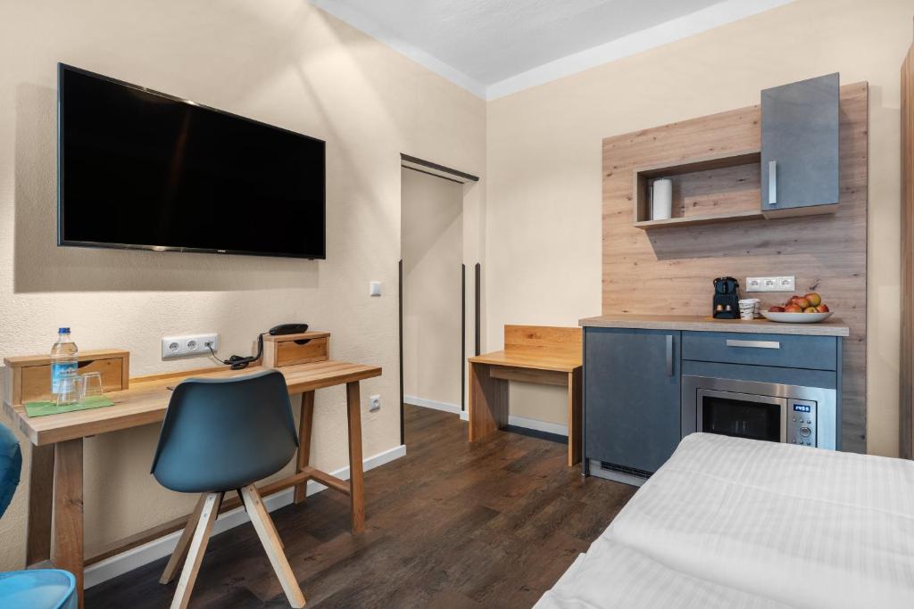 Kuchyň nebo kuchyňský kout v ubytování Schieners Hotel & Apfelhof Apartments