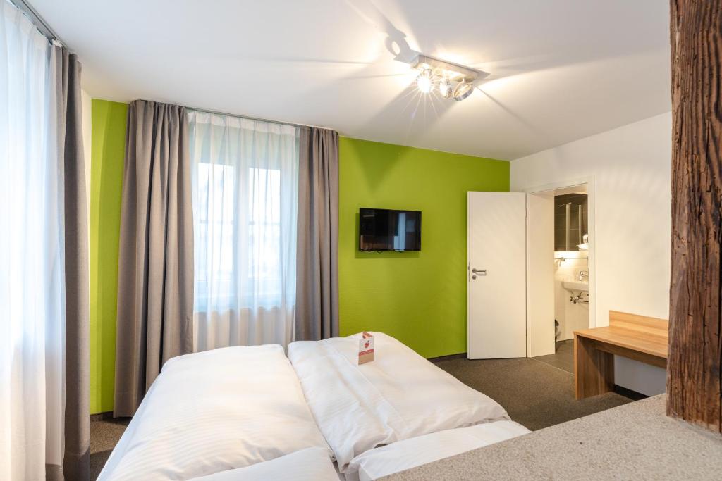 Postel nebo postele na pokoji v ubytování Schieners Hotel & Apfelhof Apartments