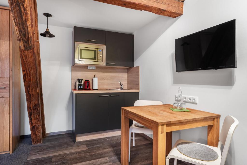 Kuchyň nebo kuchyňský kout v ubytování Schieners Hotel & Apfelhof Apartments