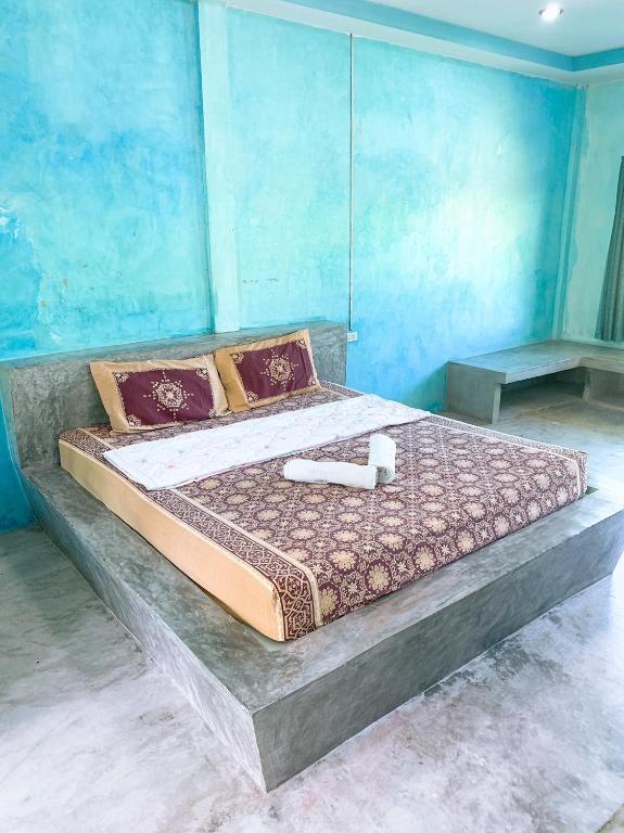 Ein Bett oder Betten in einem Zimmer der Unterkunft Sabye~Sabye