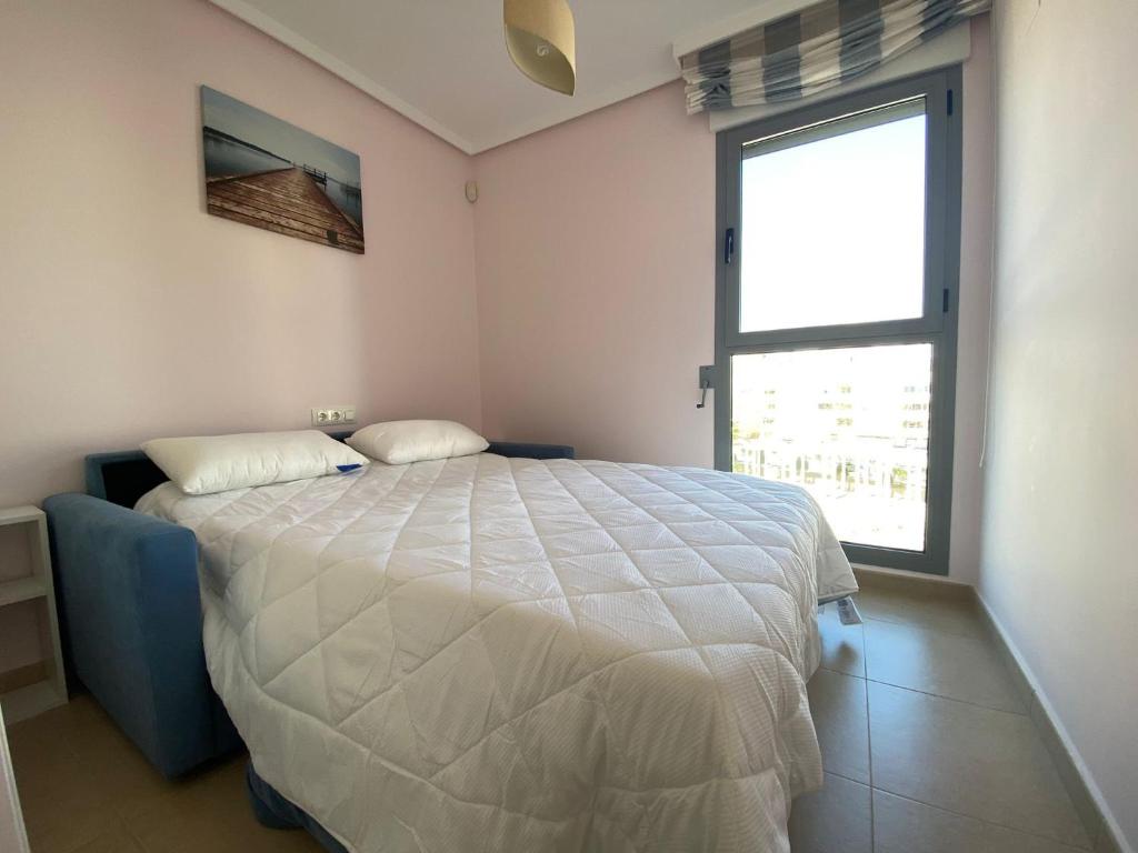 A bed or beds in a room at Plaza Mayor