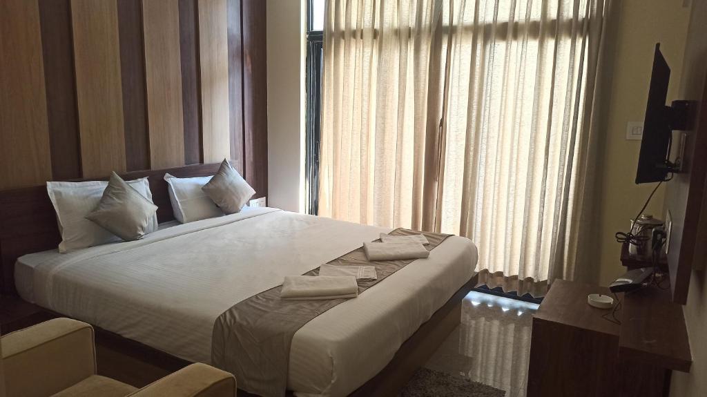 Postel nebo postele na pokoji v ubytování Hotel Ridley International