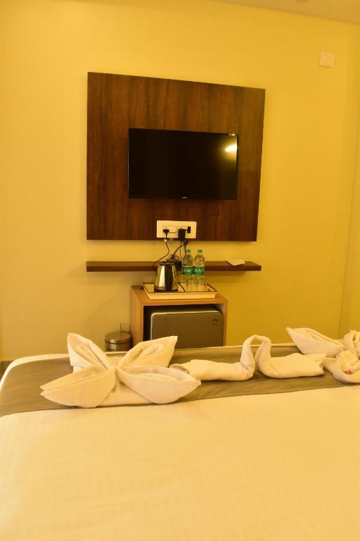 Postel nebo postele na pokoji v ubytování Hotel Ridley International