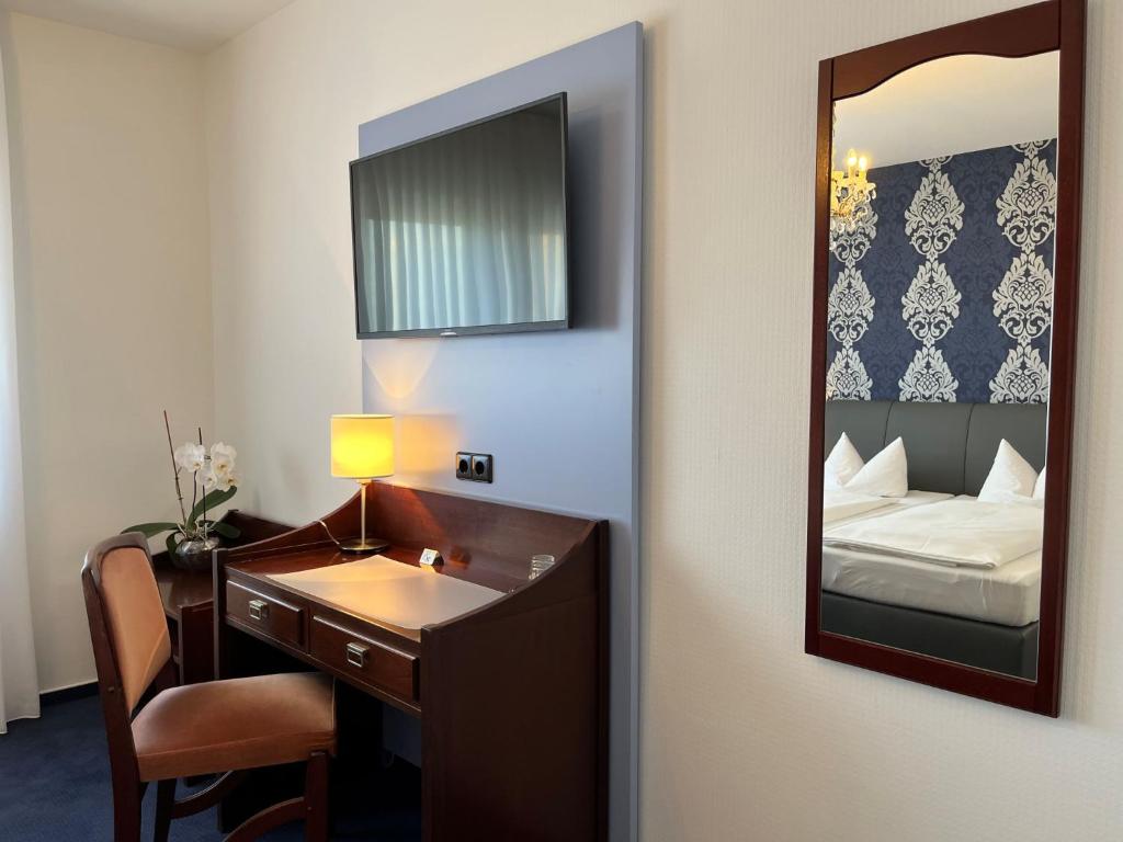 Postel nebo postele na pokoji v ubytování Hotel Garni Geisler