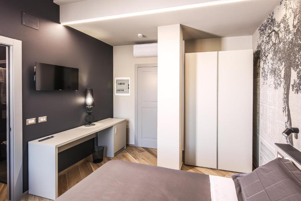 Posteľ alebo postele v izbe v ubytovaní Vicolo Malavolta 7 Rooms and Suites