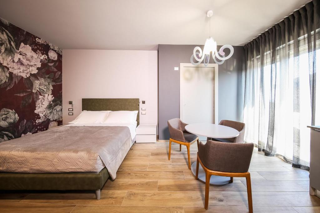 Posteľ alebo postele v izbe v ubytovaní Vicolo Malavolta 7 Rooms and Suites