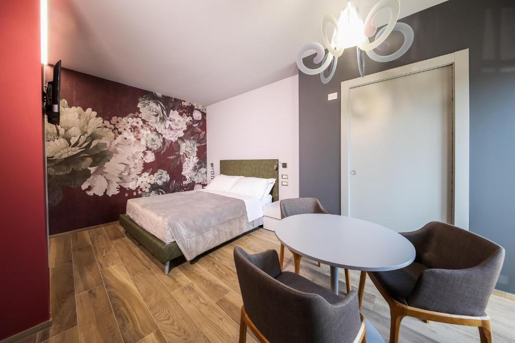 Posteľ alebo postele v izbe v ubytovaní Vicolo Malavolta 7 Rooms and Suites