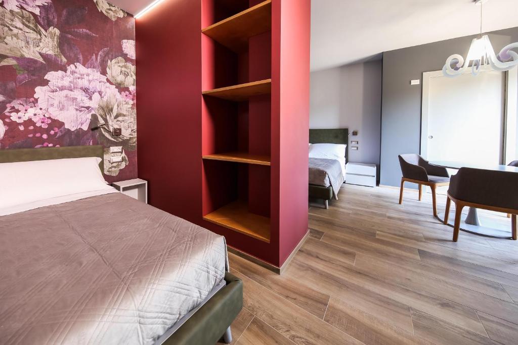 Posteľ alebo postele v izbe v ubytovaní Vicolo Malavolta 7 Rooms and Suites