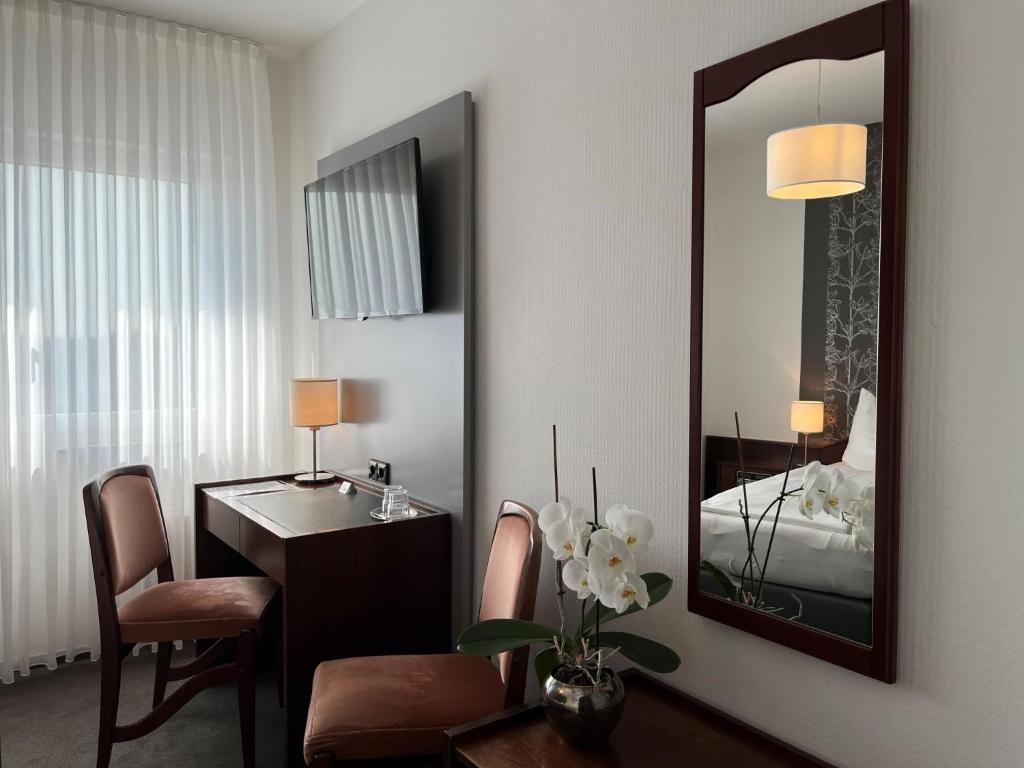 Postel nebo postele na pokoji v ubytování Hotel Garni Geisler