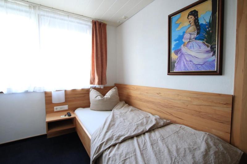 Postel nebo postele na pokoji v ubytování Hotel-Pension- Vesperstube Waldblick