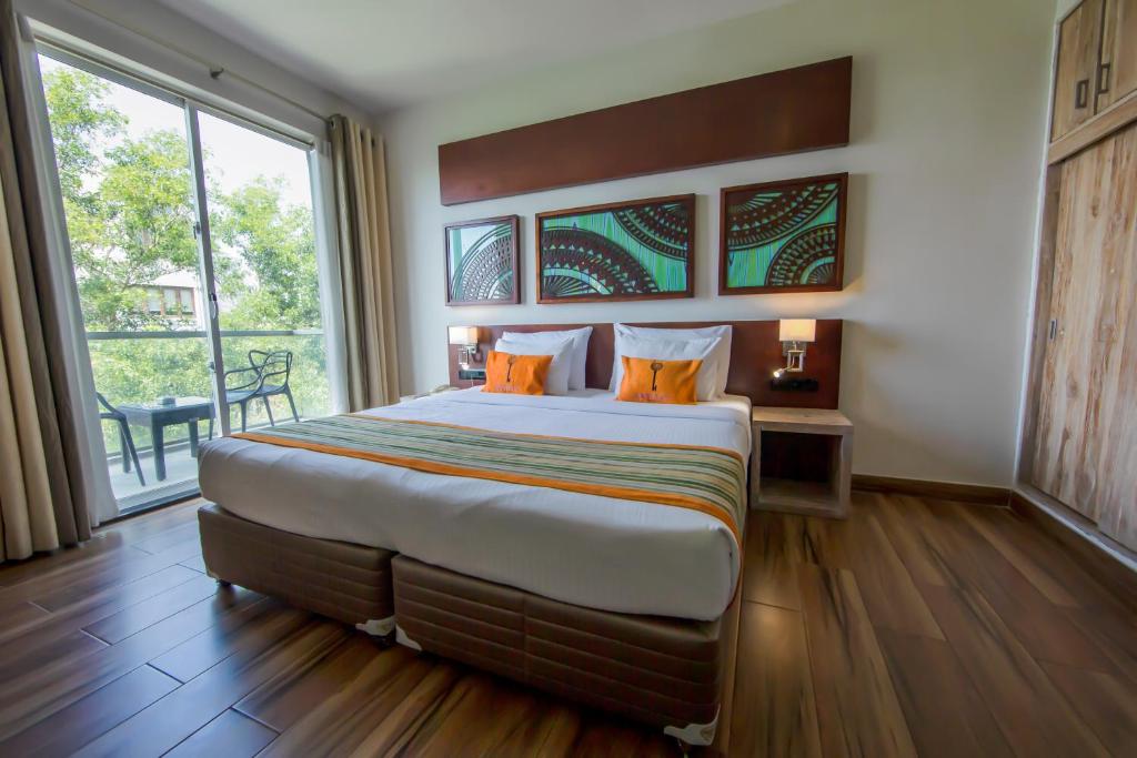 Postel nebo postele na pokoji v ubytování Skyloft Kandy by Aaradhya