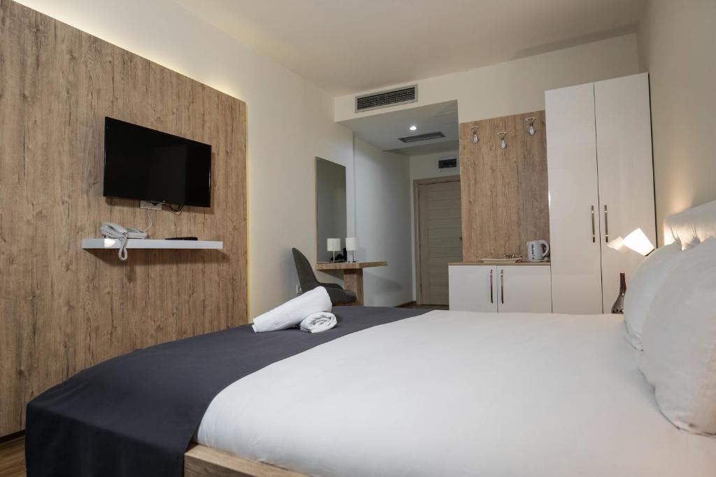 Postel nebo postele na pokoji v ubytování Hotel DOA