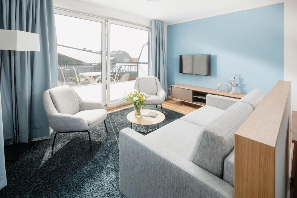 TV a/nebo společenská místnost v ubytování Apartmenthaus B3