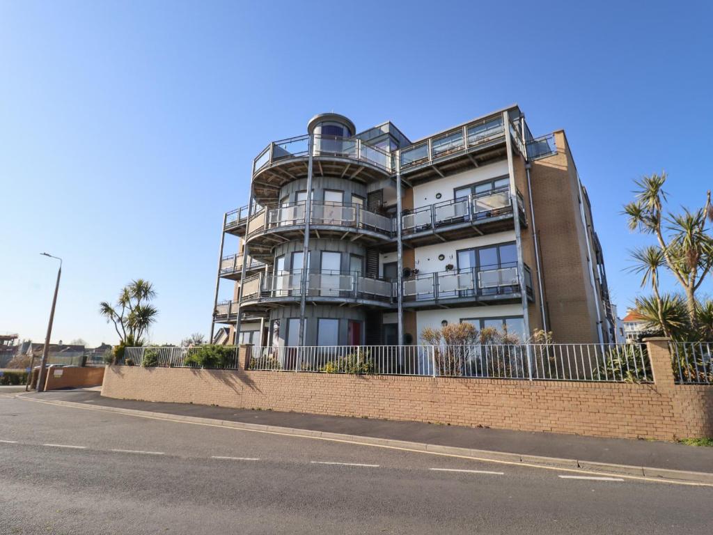 a tall building on the side of a street at Flat 19 By The Beach in Harwich