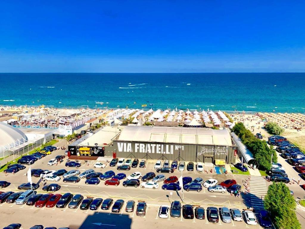 an aerial view of a parking lot next to the ocean at ANK Summerland Mamaia in Mamaia
