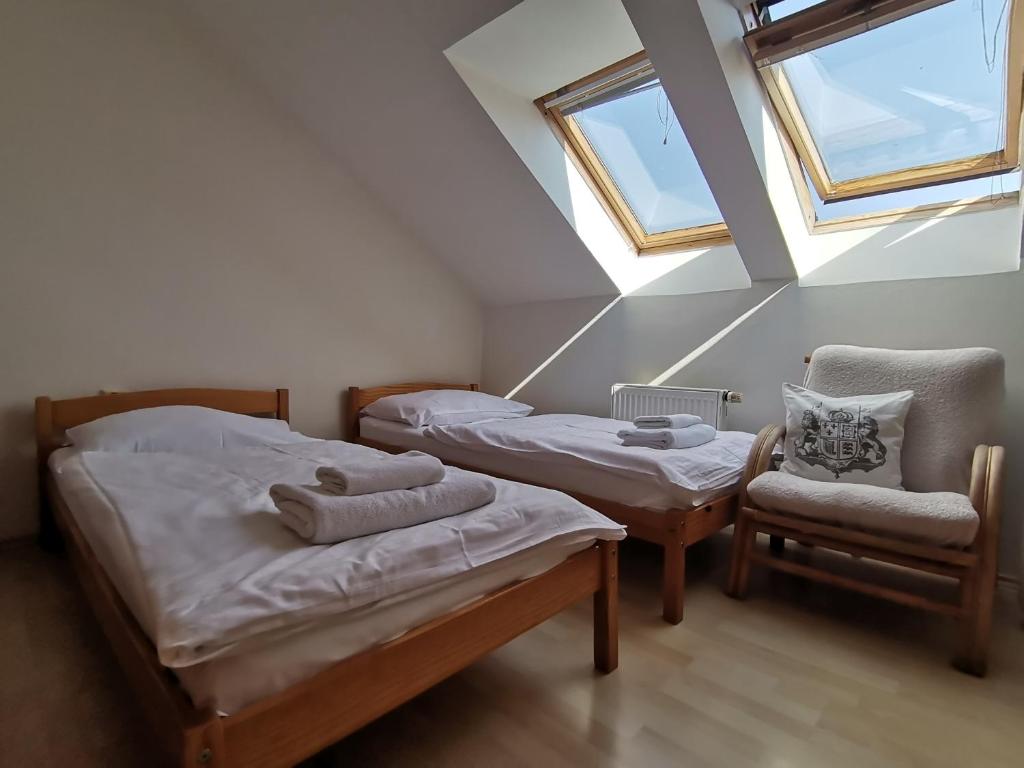 Postel nebo postele na pokoji v ubytování Penzion pod Kostelíčkem