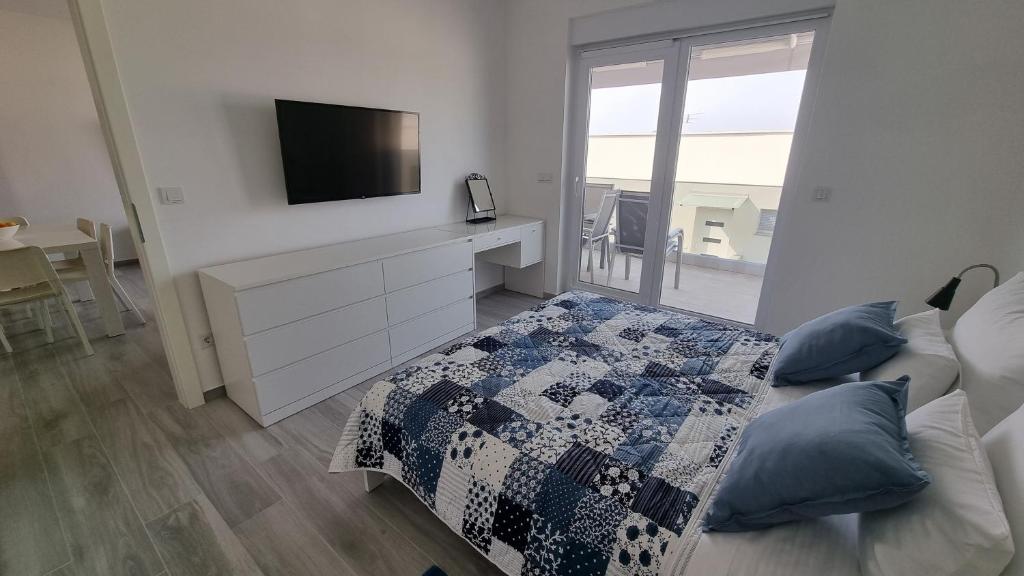 Postel nebo postele na pokoji v ubytování Simuni Delight