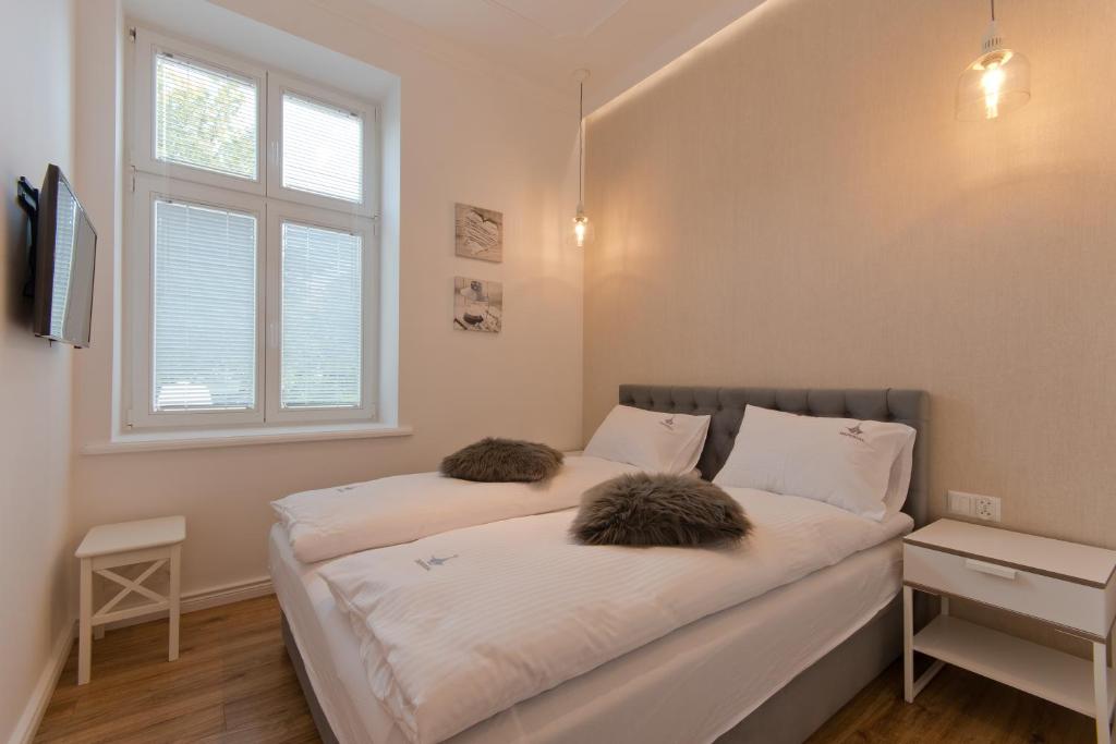 Posteľ alebo postele v izbe v ubytovaní Imperial Apartments Helska