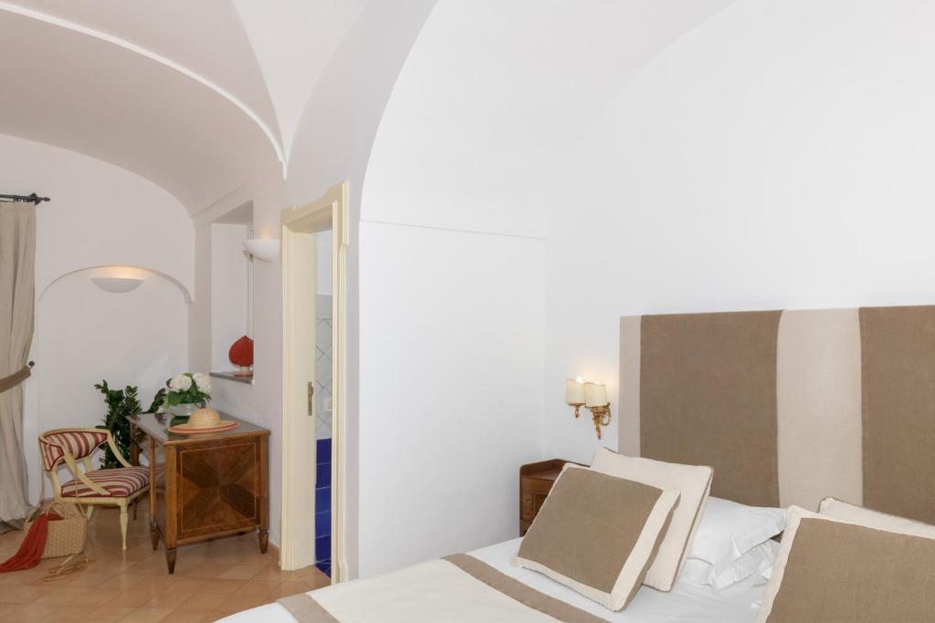 Postel nebo postele na pokoji v ubytování Hotel L'Ancora