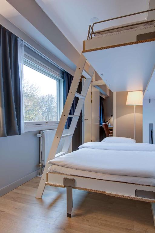 Postel nebo postele na pokoji v ubytování Radisson Blu Park Hotel, Oslo