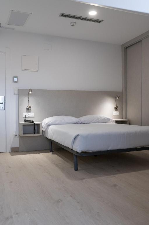 Postel nebo postele na pokoji v ubytování PALACIO REAL HOSTEL